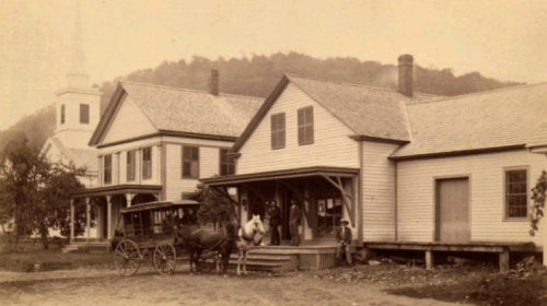Picture approximately 1880
Far left - former Buckland Center Church (later moved behind Mary Lyon Church to become the Buckland Grange, Center, our apartment building, Right, the Buckland Center store and Post Office
Buckland Public Library is not visible behind tree at left.  
