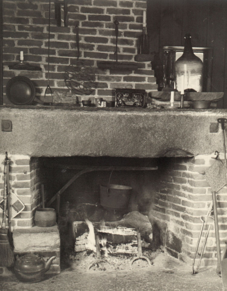Closeup of fireplace. Note cooking pots used to cook Studio suppers.  A trivet used for grilling over hot coals, and a bread toaster, both hang above the fireplace.