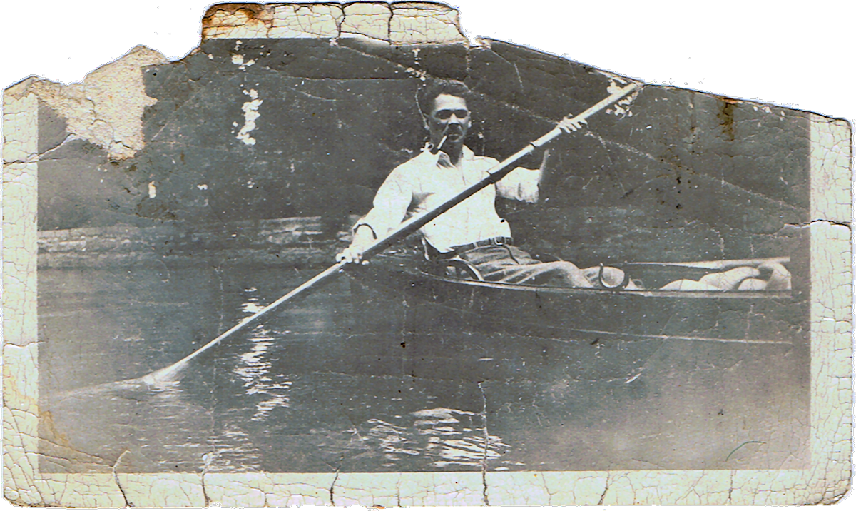 Woodward paddling in a canoe