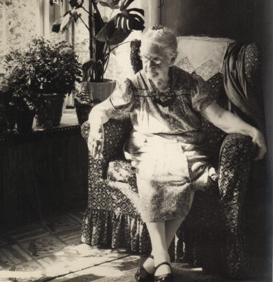 Gramma Woodward in her usual chair in front of the bay window