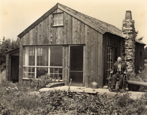 Robert Strong Woodward along side the Heath Pasture Studio on Burnt Hill 