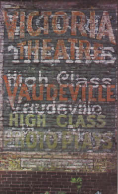 Sign on a wall for Victoria Theater