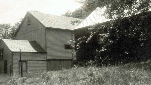  Chicken house, left, attached to the barn. This is to be removed and attached <br/>to the main house.  Blacksmith shop is on right. 