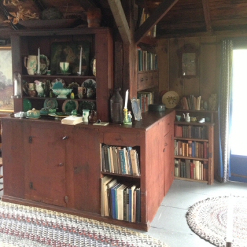 A photograph of the bookshelves and cabinets today