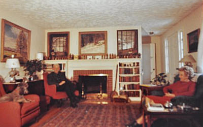 Robert Strong Woodward paintings hanging in the living room of F. E. Williams 